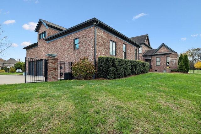 view of side of home with a lawn