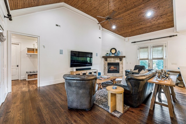 living room with ceiling fan, a fireplace, dark hardwood / wood-style floors, crown molding, and wooden ceiling