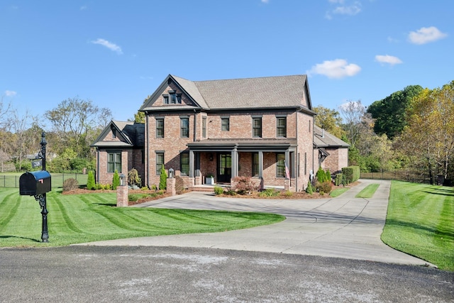 craftsman-style home featuring a front lawn and covered porch