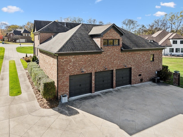 view of side of property featuring a garage