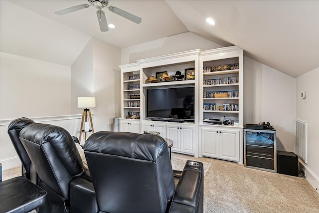 carpeted living room with lofted ceiling, wine cooler, and ceiling fan