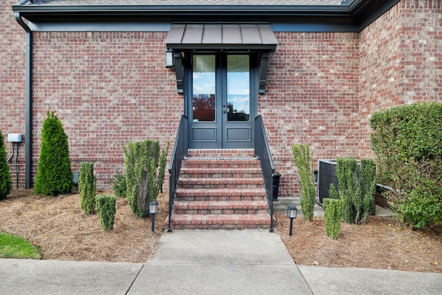 property entrance with central air condition unit and french doors