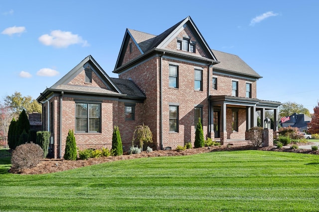 view of front of house with a front lawn and covered porch