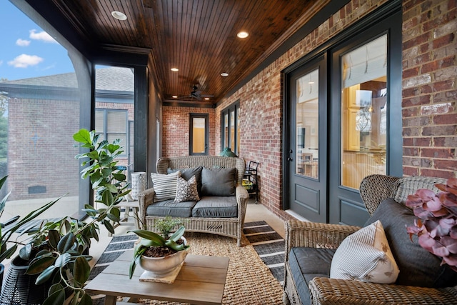 balcony featuring ceiling fan and an outdoor living space