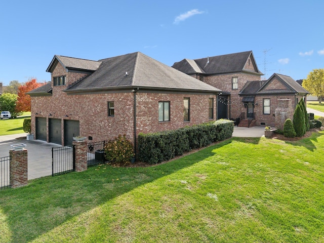 back of house featuring a lawn and a garage