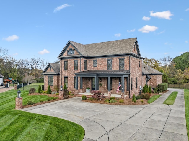 view of front of property with a front yard and a porch