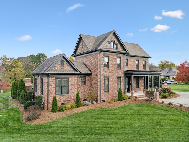 view of front of house with a front lawn and a porch