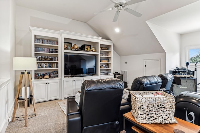 carpeted living room with ceiling fan