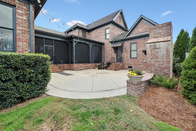 view of front of house featuring a patio and a sunroom