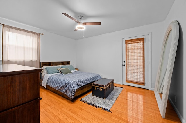 bedroom with ceiling fan and light wood-type flooring