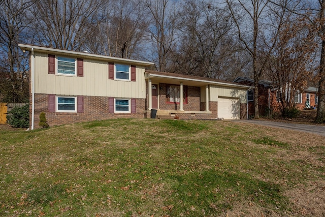 split level home with a front yard and a garage