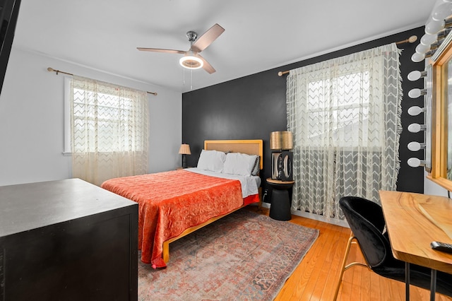 bedroom featuring ceiling fan and wood-type flooring