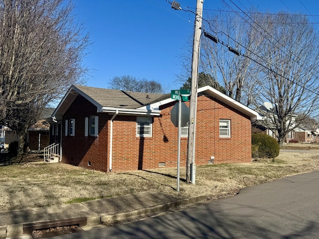 view of home's exterior featuring a yard