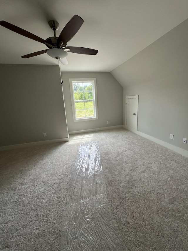 bonus room featuring carpet, vaulted ceiling, and ceiling fan