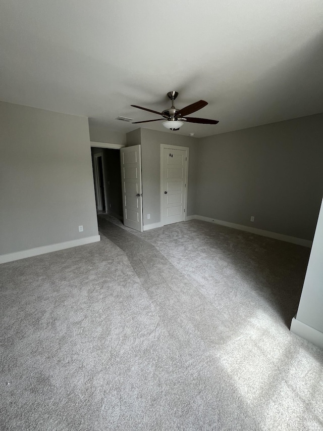 unfurnished bedroom with ceiling fan and carpet flooring