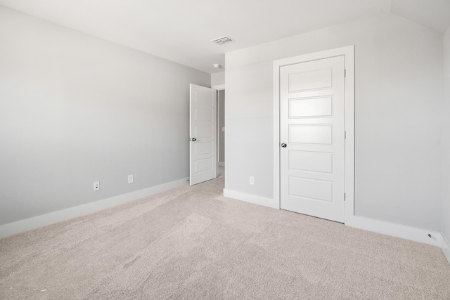 unfurnished bedroom featuring light colored carpet