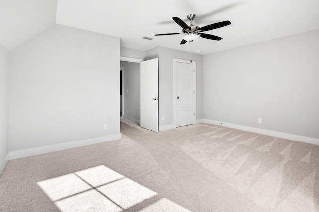 unfurnished bedroom with light colored carpet and ceiling fan