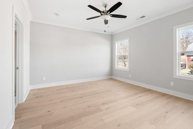 spare room with ornamental molding, ceiling fan, and light hardwood / wood-style flooring