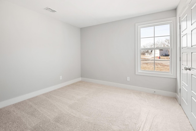 empty room with carpet flooring