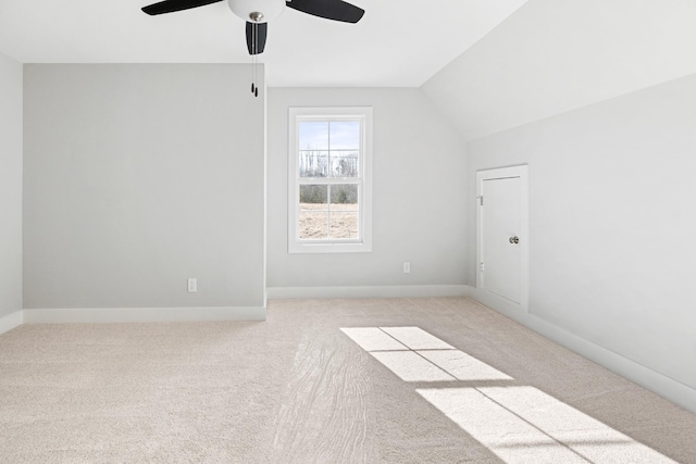 bonus room featuring vaulted ceiling, light colored carpet, and ceiling fan