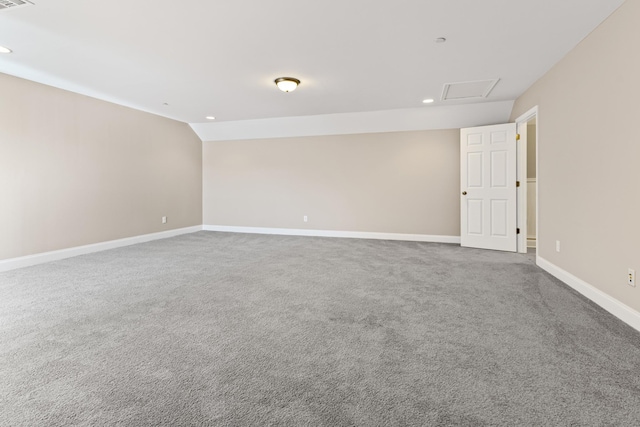 unfurnished room with lofted ceiling and carpet