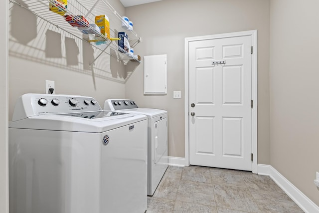 clothes washing area featuring washer and clothes dryer