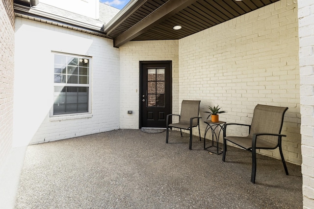 entrance to property featuring a patio area