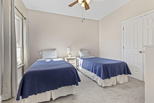 bedroom with ceiling fan and carpet flooring