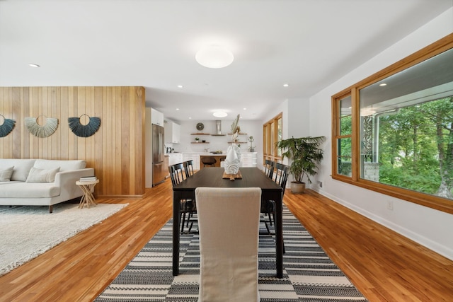 dining space with light hardwood / wood-style floors