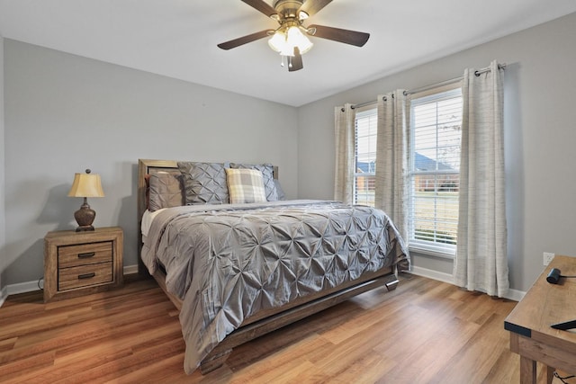 bedroom featuring ceiling fan and hardwood / wood-style floors