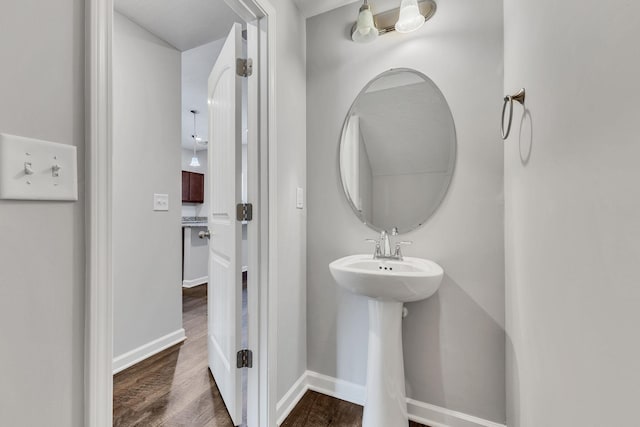 bathroom with sink and hardwood / wood-style floors