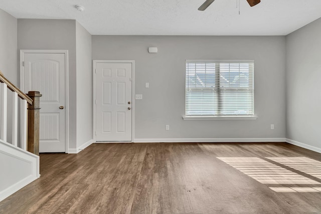 entrance foyer featuring ceiling fan and hardwood / wood-style floors