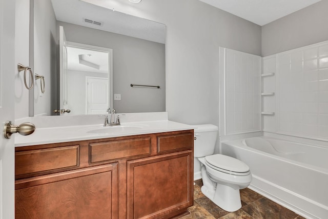 full bathroom featuring toilet, vanity, and tub / shower combination