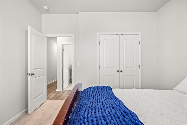 bedroom featuring a closet and carpet floors