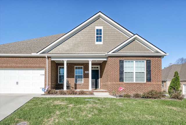 craftsman-style house featuring a front lawn and a garage