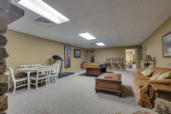 playroom with carpet, pool table, and a drop ceiling