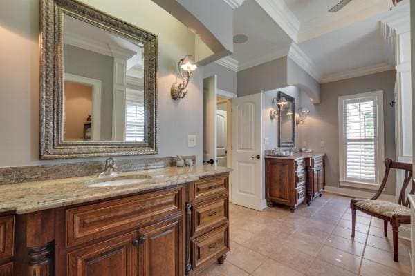 bathroom with tile patterned floors, vanity, and crown molding