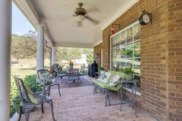 view of patio / terrace with ceiling fan and area for grilling