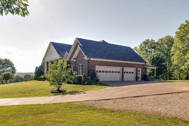 view of front of home with a front lawn and a garage