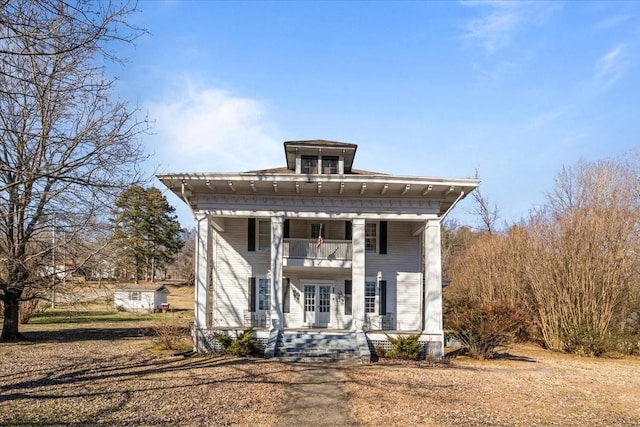 neoclassical / greek revival house with a balcony