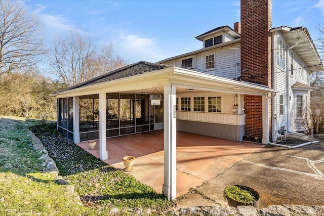 view of home's exterior featuring a sunroom