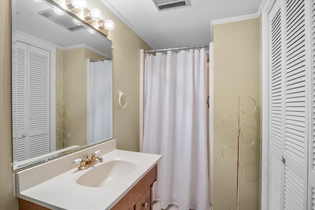 bathroom with vanity and crown molding