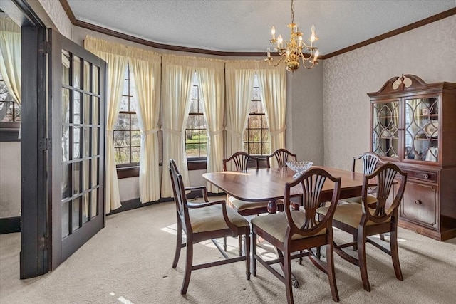 dining room with light carpet, crown molding, and a notable chandelier