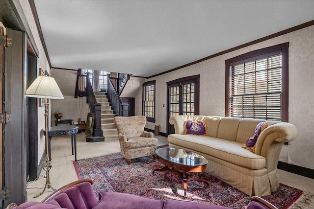 carpeted living room featuring ornamental molding and a textured ceiling