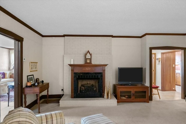 living room featuring light colored carpet, a brick fireplace, crown molding, and a textured ceiling