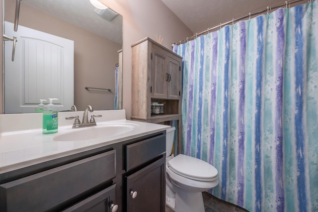 bathroom featuring vanity, toilet, a textured ceiling, and a shower with shower curtain