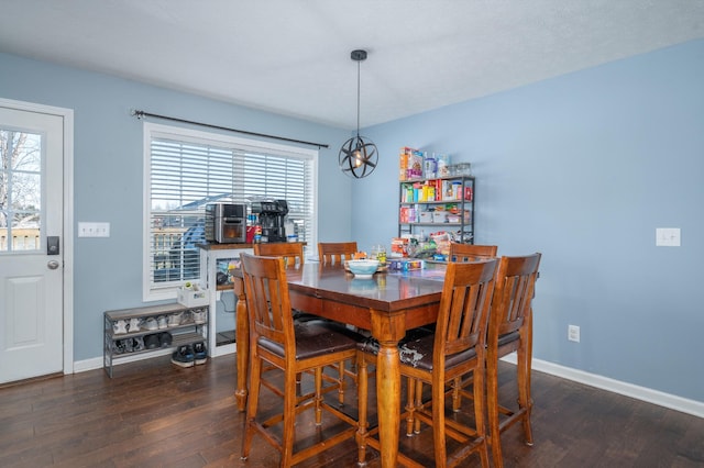 dining space featuring dark hardwood / wood-style floors and a healthy amount of sunlight