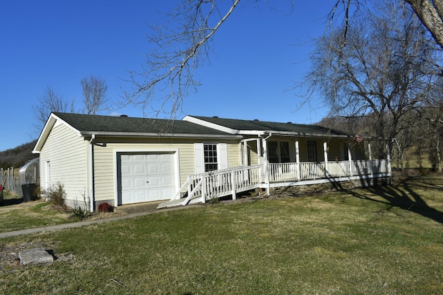 single story home with a front lawn, a garage, and a porch