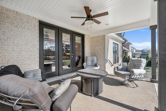 view of patio featuring french doors and ceiling fan