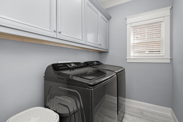 laundry area with cabinets and washing machine and dryer